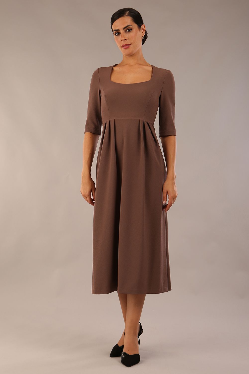 model wearing a diva catwalk Padstow Midi A-line Dress elbow length sleeves and midi length with empire waistline in peppercorn brown colour