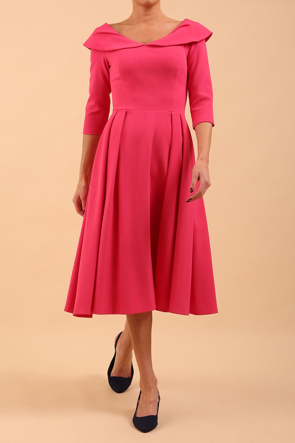 Model wearing Diva Catwalk Chesterton Sleeved dress with oversized collar detail and a-line swing pleated skirt in colour fuchsia pink front