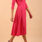 Model wearing Diva Catwalk Chesterton Sleeved dress with oversized collar detail and a-line swing pleated skirt in colour fuchsia pink front side
