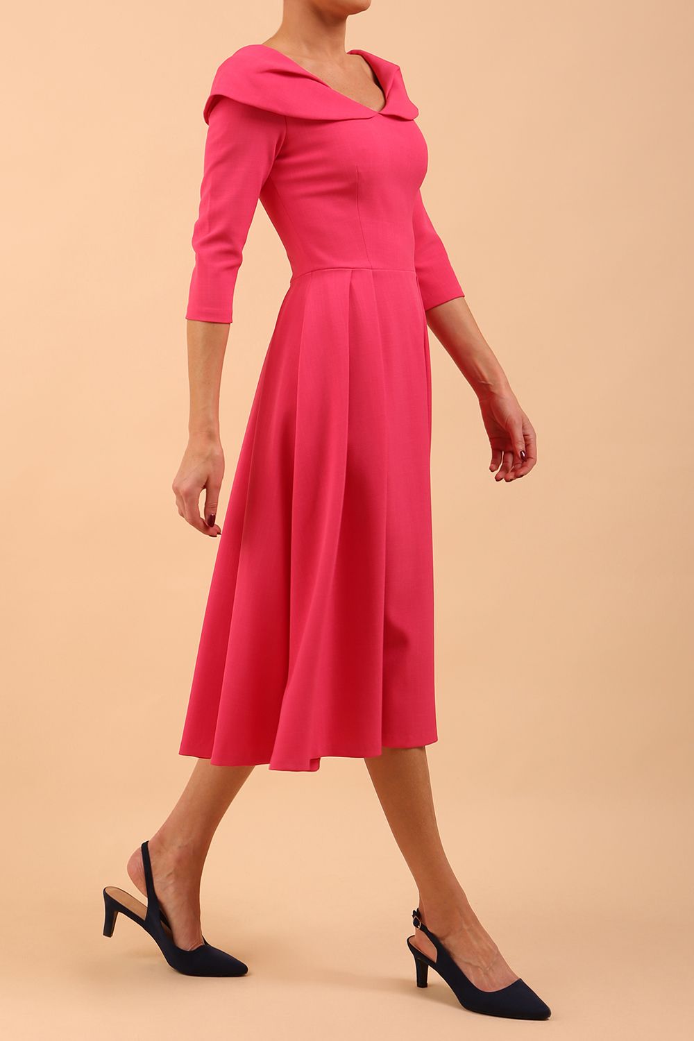 Model wearing Diva Catwalk Chesterton Sleeved dress with oversized collar detail and a-line swing pleated skirt in colour fuchsia pink front side