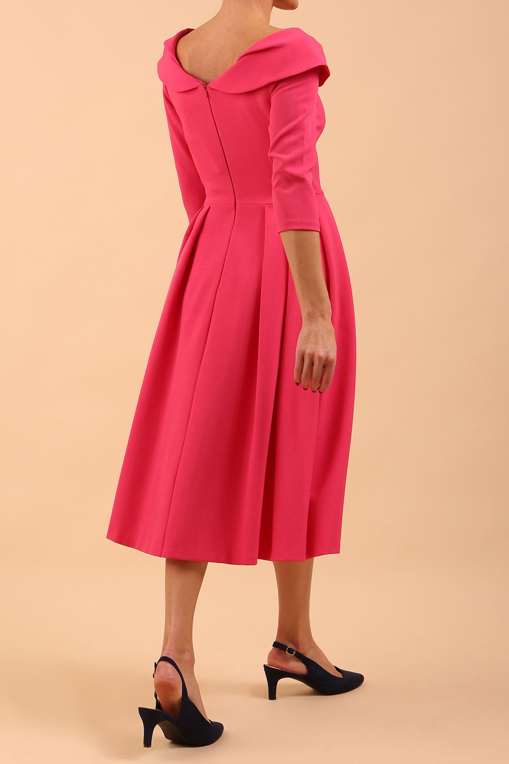 Model wearing Diva Catwalk Chesterton Sleeved dress with oversized collar detail and a-line swing pleated skirt in colour fuchsia pink back