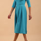 Model wearing Diva Catwalk Chesterton Sleeved dress with oversized collar detail and a-line swing pleated skirt in colour azure blue front side