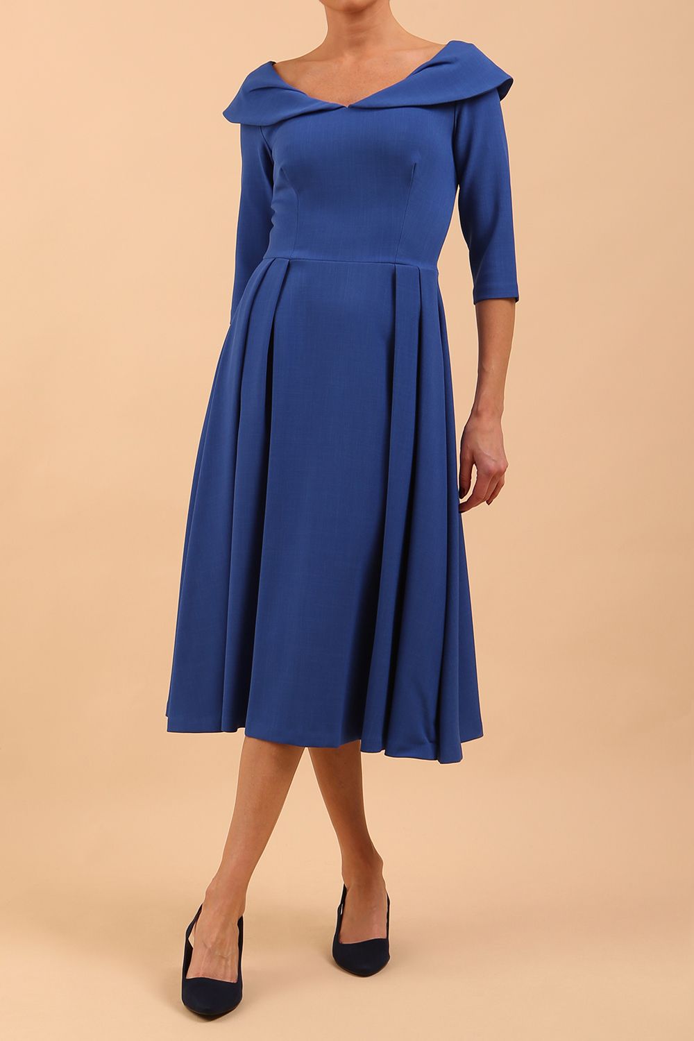 Model wearing Diva Catwalk Chesterton Sleeved dress with oversized collar detail and a-line swing pleated skirt in colour cobalt blue front
