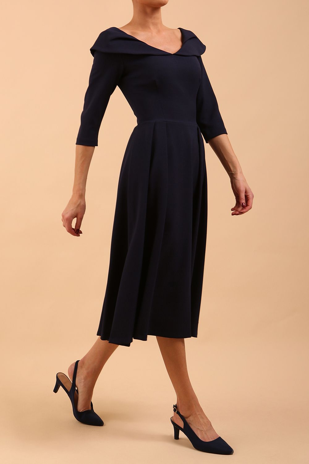 Model wearing Diva Catwalk Chesterton Sleeved dress with oversized collar detail and a-line swing pleated skirt in colour navy blue front