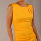 model wearing diva catwalk primula pencil skirt dress in pink with pleating on one side and sleeveless design in colour saffron yellow front detail close up