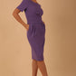 Brunette model is wearing marcel stretch short sleeve pencil dress image in lavender purple colour