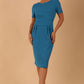 Brunette model is wearing marcel stretch short sleeve pencil dress image in malibu blue colour