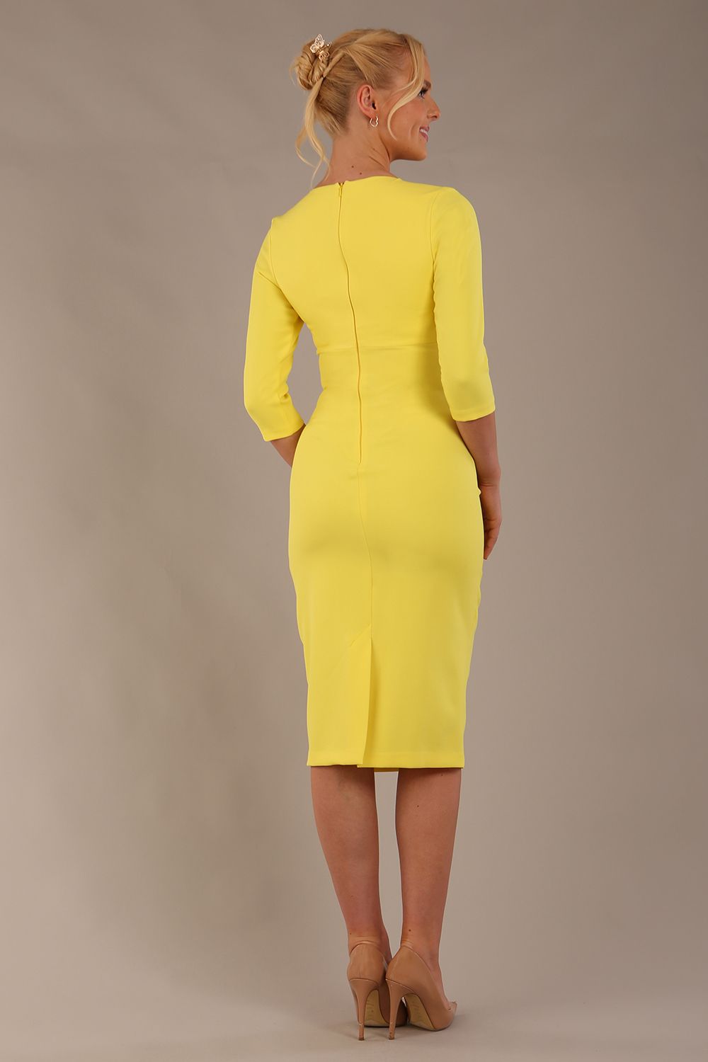 model wearing diva catwalk ubrique pencil dress with a keyhole detail and sleeves in blazing yellow colour back (Blazing Yellow)