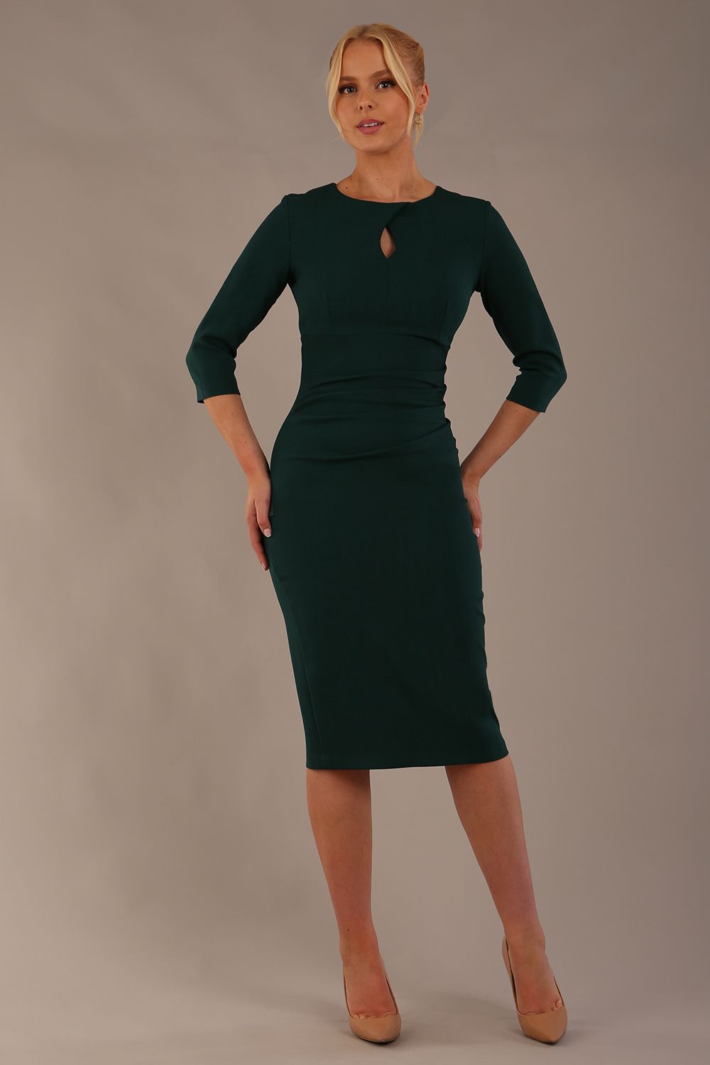 model is wearing the Diva Catwalk Ubrique pencil dress with Long sleeves and keyhole detail in Forest Green fabric colour (Forest Green)