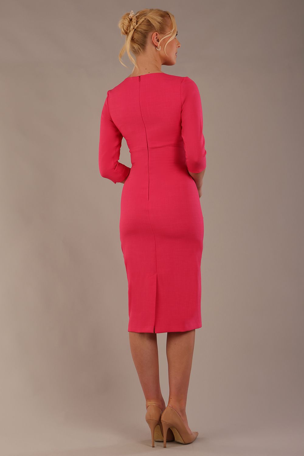 brunette model wearing diva catwalk ubrique pencil dress with a keyhole detail and sleeves in fuchsia pink back (Fuchsia Pink)