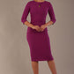 model wearing diva catwalk ubrique pencil dress with a keyhole detail and sleeves in hollyhock purple colour front (Hollyhock Purple)