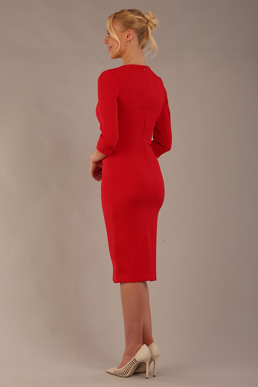 model wearing diva catwalk ubrique pencil dress with a keyhole detail and sleeves in scarlet red back (Scarlet Red)