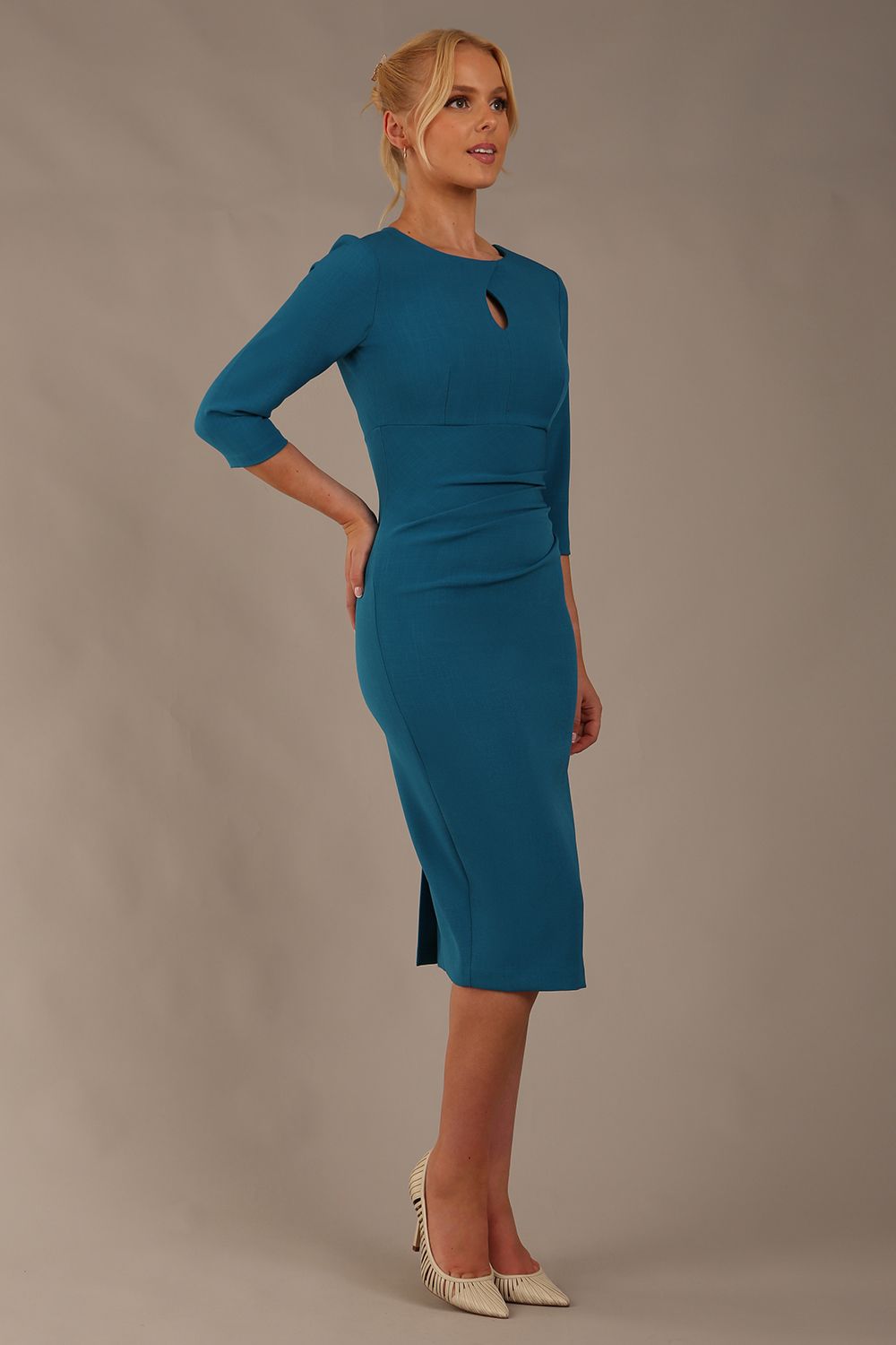 model wearing diva catwalk ubrique pencil dress with a keyhole detail and sleeves in teal colour front (Teal)