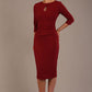 model is wearing the Diva Catwalk Ubrique pencil dress with Long sleeves and keyhole detail in Wine fabric colour (Wine)