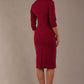 model wearing diva catwalk ubrique pencil dress with a keyhole detail and sleeves in berry pink colour back (Berry Pink)