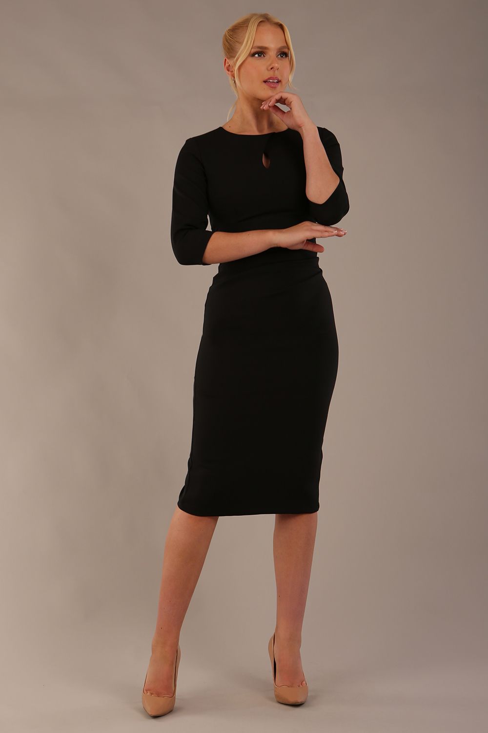 model is wearing the Diva Catwalk Ubrique pencil dress with Long sleeves and keyhole detail in Black colour (Black)