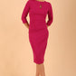 brunette model wearing diva catwalk ubrique pencil dress with a keyhole detail and sleeves in Magenta Haze colour front