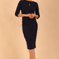 model is wearing the Diva Catwalk Ubrique pencil dress with Long sleeves and keyhole detail in Navy Blue fabric colour
