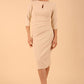model wearing diva catwalk ubrique pencil dress with a keyhole detail and sleeves in sandshell beige front