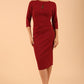 model is wearing the Diva Catwalk Ubrique pencil dress with Long sleeves and keyhole detail in Wine fabric colour