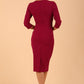brunette model wearing diva catwalk ubrique pencil dress with a keyhole detail and sleeves in berry pink colour back