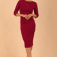 brunette model wearing diva catwalk ubrique pencil dress with a keyhole detail and sleeves in berry pink colour front