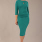model wearing diva catwalk ubrique pencil dress with a keyhole detail and sleeves in parasailing green