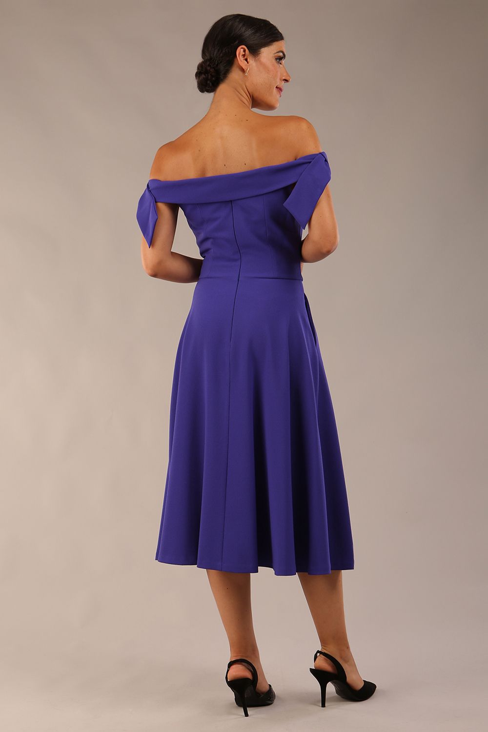 model wearing a diva catwalk Portobello Swing Dress Off-shoulder sleeveless neckline in spectrum indigo colour