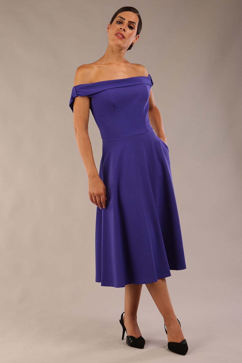 model wearing a diva catwalk Portobello Swing Dress Off-shoulder sleeveless neckline in spectrum indigo colour