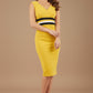 Woman wearing a yellow dress with a black and white stripe on a beige background (Mustard Yellow & Black)