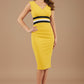 Woman wearing a yellow dress with a black and white band on a beige background (Mustard Yellow & Black)