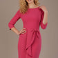model is wearing diva catwalk jacky dress with rounded neckline 3/4 sleeve and bow detail on the waist in honeysuckle pink front view