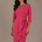 model is wearing diva catwalk jacky dress with rounded neckline 3/4 sleeve and bow detail on the waist in honeysuckle pink front view