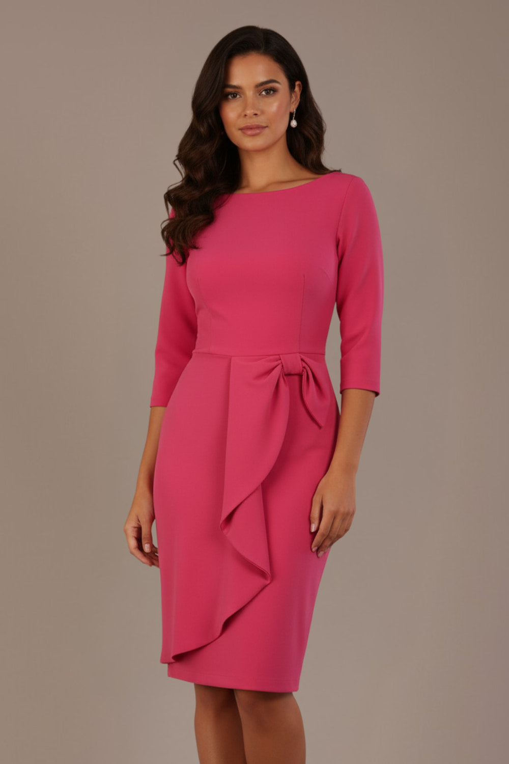 model is wearing diva catwalk jacky dress with rounded neckline 3/4 sleeve and bow detail on the waist in honeysuckle pink front view