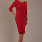 model is wearing diva catwalk jacky dress with rounded neckline 3/4 sleeve and bow detail on the waist in Dazzle pink front view