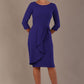 model is wearing diva catwalk jacky dress with rounded neckline 3/4 sleeve and bow detail on the waist in spectrum indigo front view