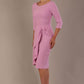 model is wearing diva catwalk jacky dress with rounded neckline 3/4 sleeve and bow detail on the waist in dawn pink front view