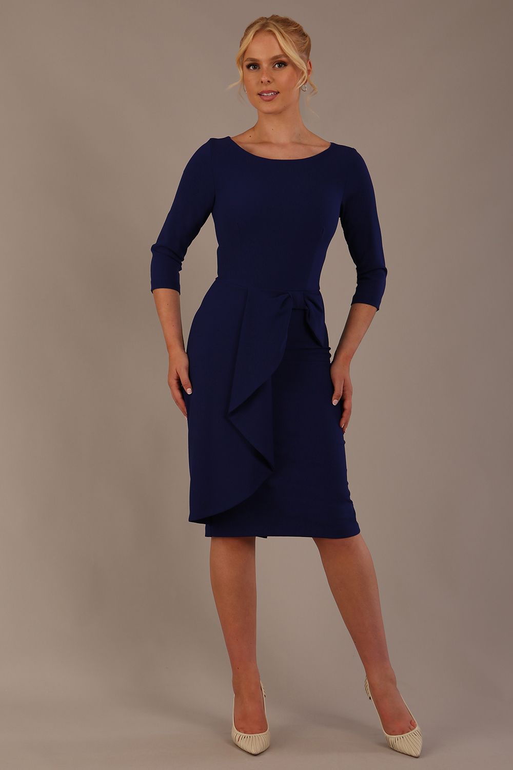 model is wearing diva catwalk jacky dress with rounded neckline 3/4 sleeve and bow detail on the waist in oxford blue front view