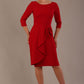 model is wearing diva catwalk jacky dress with rounded neckline 3/4 sleeve and bow detail on the waist in scarlet red front view