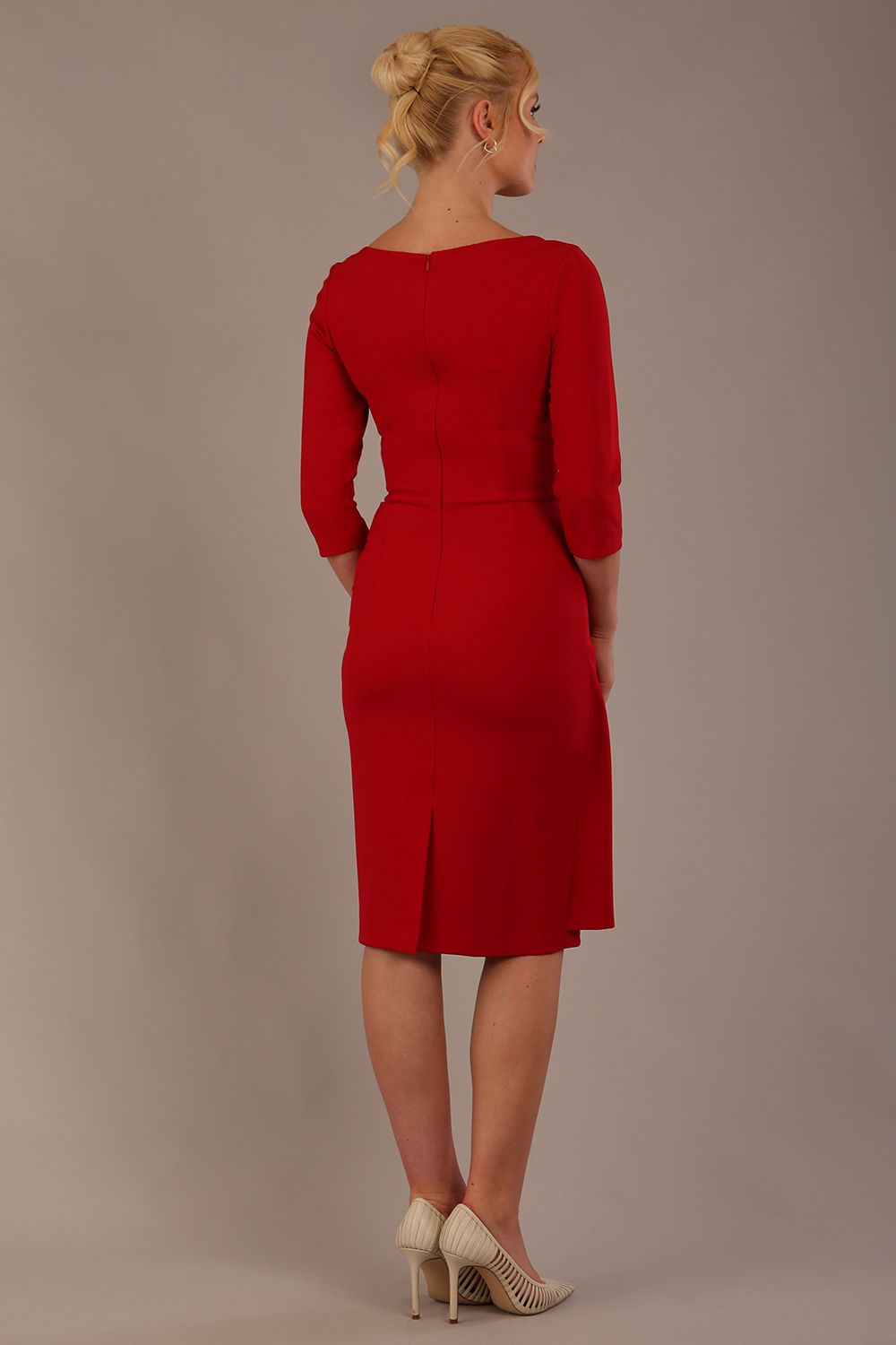 model is wearing diva catwalk jacky dress with rounded neckline 3/4 sleeve and bow detail on the waist in scarlet red back view