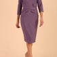Model wearing diva catwalk Seed Andante Pencil Skirt Dress with 3/4 sleeve and bow detail at waistline in Dusky Lilac front
