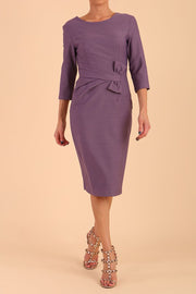 Model wearing diva catwalk Seed Andante Pencil Skirt Dress with 3/4 sleeve and bow detail at waistline in Dusky Lilac front