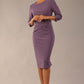 Model wearing diva catwalk Seed Andante Pencil Skirt Dress with 3/4 sleeve and bow detail at waistline in Dusky Lilac front