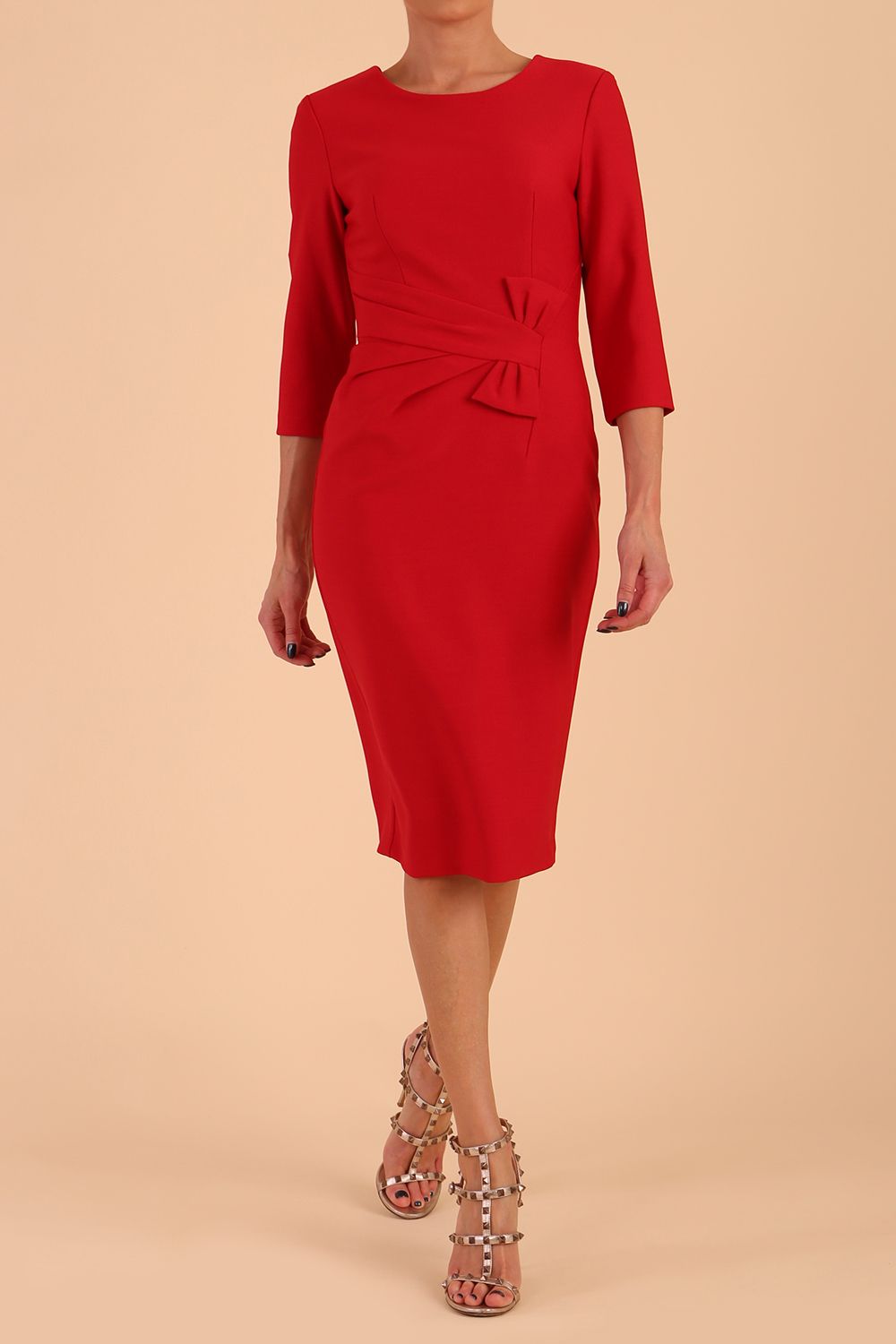Model wearing diva catwalk Seed Andante Pencil Skirt Dress with 3/4 sleeve and bow detail at waistline in Salsa Red front