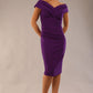 Model is wearing an off shoulder pencil dress by Diva Catwalk in deep purple