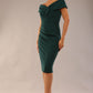 Model is wearing an off shoulder pencil dress by Diva Catwalk in forest green