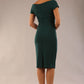 Model is wearing an off shoulder pencil dress by Diva Catwalk in forest green