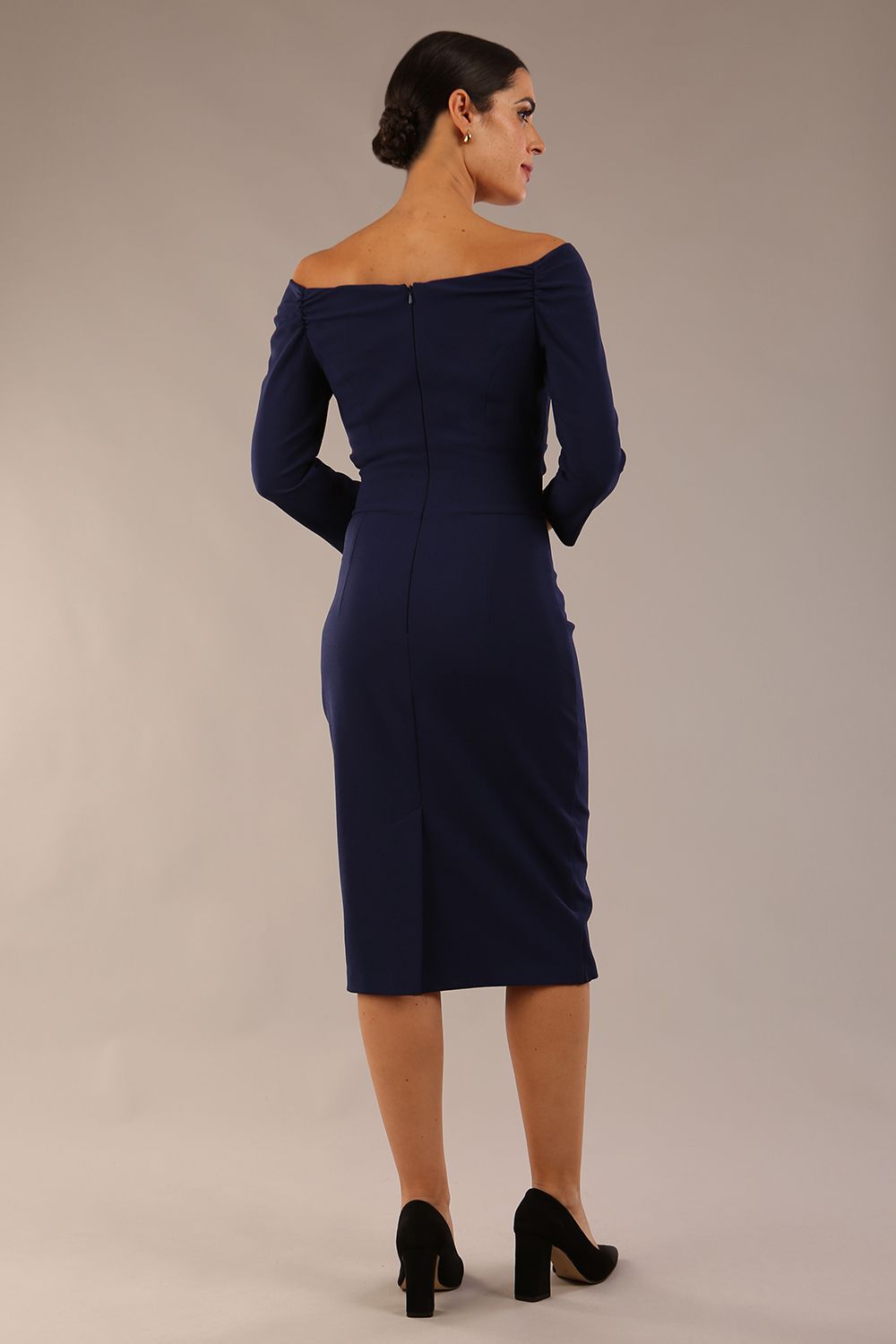 brunette model wearing diva catwalk evening pencil dress off shoulder with sleeves and pleated pencil skirt in colour navy blue front