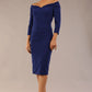 brunette model wearing diva catwalk evening pencil dress off shoulder with sleeves and pleated pencil skirt in colour oxford blue front