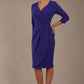 model wearing diva pencil dress tulip design with overlapping pencil skirt with 3 4 sleeves in colour spectrum indigo front (Spectrum Indigo)